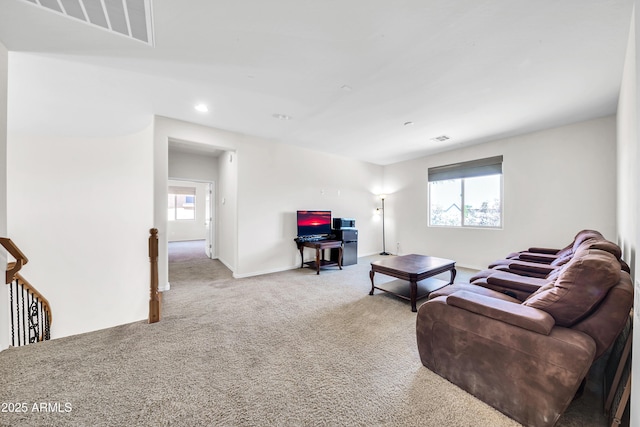 living room with carpet flooring and a wealth of natural light