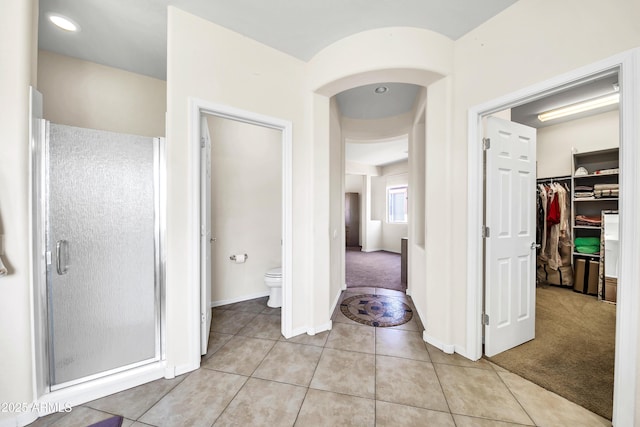 corridor featuring light tile patterned flooring