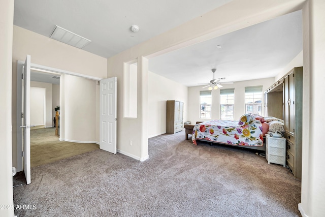 bedroom with ceiling fan and carpet flooring