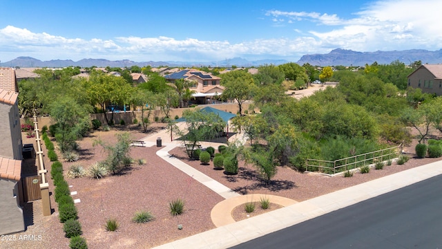 birds eye view of property featuring a mountain view