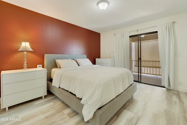 bedroom with light hardwood / wood-style flooring