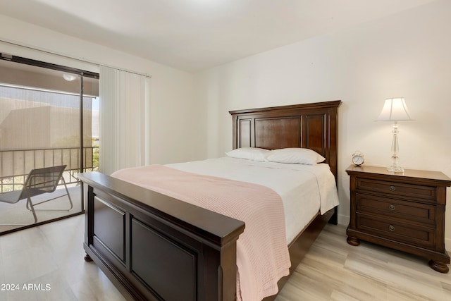 bedroom featuring access to exterior and light hardwood / wood-style flooring