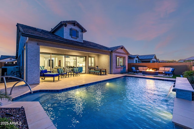 view of pool featuring an outdoor living space with a fire pit, a patio, and a fenced backyard