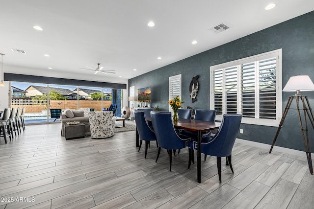 dining space featuring a ceiling fan, light wood-style floors, recessed lighting, and baseboards