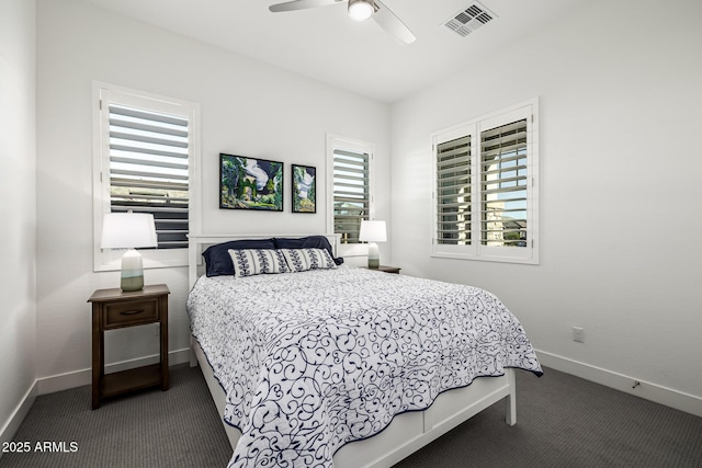 carpeted bedroom with baseboards and a ceiling fan