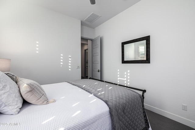 carpeted bedroom with baseboards and a ceiling fan