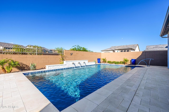view of pool with a fenced backyard and a patio