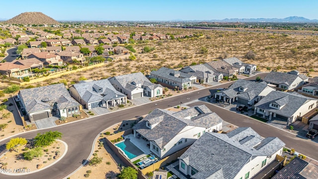 aerial perspective of suburban area featuring a mountain backdrop