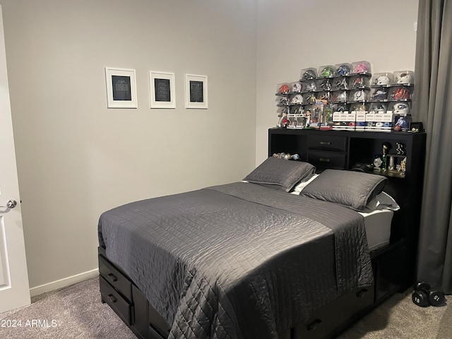 bedroom featuring carpet floors and baseboards