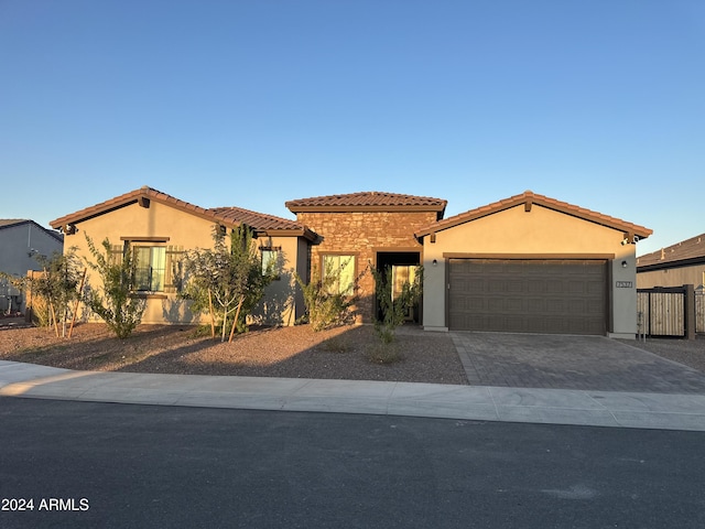 mediterranean / spanish-style house featuring a garage