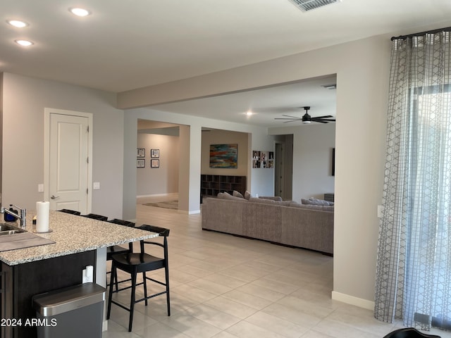 dining space featuring light tile patterned floors, recessed lighting, visible vents, ceiling fan, and baseboards