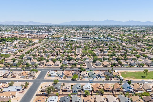 6938 W Nicolet Ave, Glendale, AZ 85303 - aerial view of property and surrounding area with a mountainous background and nearby suburban area