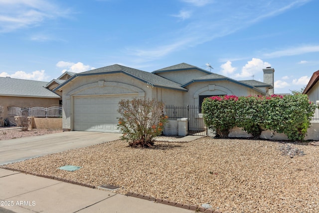 6938 W Nicolet Ave, Glendale, AZ 85303 - single story home featuring an attached garage, driveway, a gate, stucco siding, and a chimney
