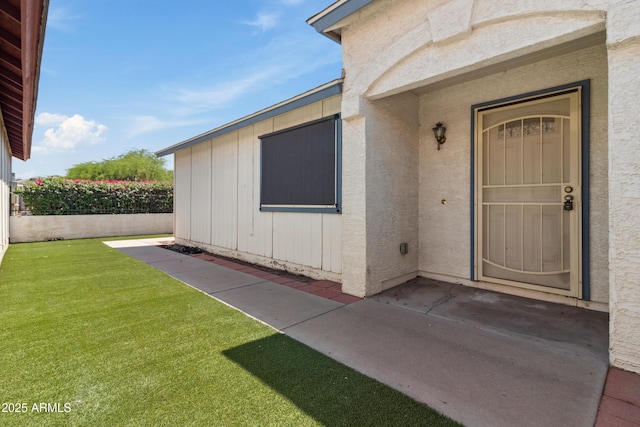 6938 W Nicolet Ave, Glendale, AZ 85303 - doorway to property with a lawn and stucco siding