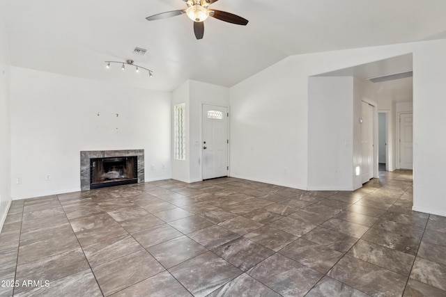 6938 W Nicolet Ave, Glendale, AZ 85303 - unfurnished living room with a ceiling fan, a fireplace, vaulted ceiling, and baseboards
