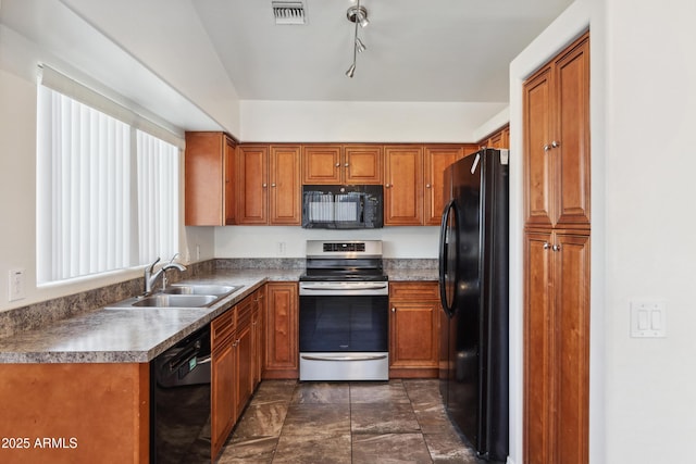6938 W Nicolet Ave, Glendale, AZ 85303 - kitchen featuring black appliances, a sink, and brown cabinetry