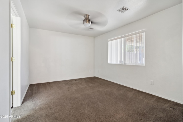 6938 W Nicolet Ave, Glendale, AZ 85303 - spare room with carpet floors, a ceiling fan, and baseboards