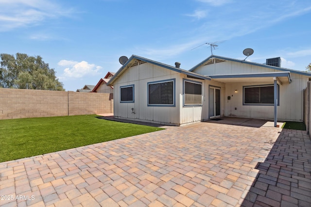 6938 W Nicolet Ave, Glendale, AZ 85303 - back of house featuring central AC unit and a patio area