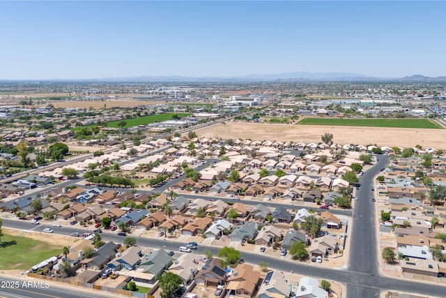 6938 W Nicolet Ave, Glendale, AZ 85303 - aerial overview of property's location with a mountain backdrop and nearby suburban area