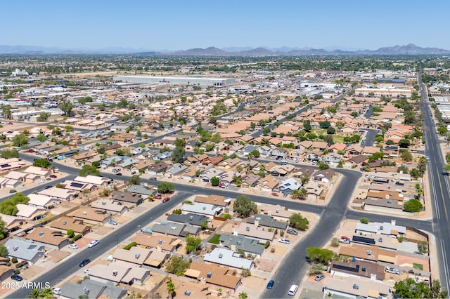6938 W Nicolet Ave, Glendale, AZ 85303 - aerial overview of property's location featuring a mountain backdrop and nearby suburban area
