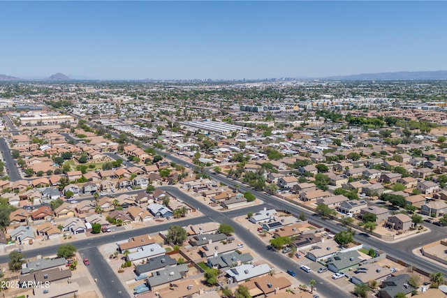 6938 W Nicolet Ave, Glendale, AZ 85303 - aerial overview of property's location featuring a mountainous background and nearby suburban area