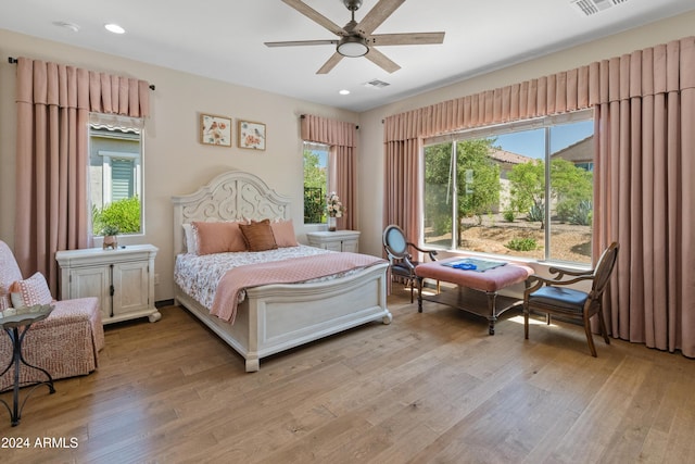 bedroom featuring ceiling fan and light hardwood / wood-style flooring