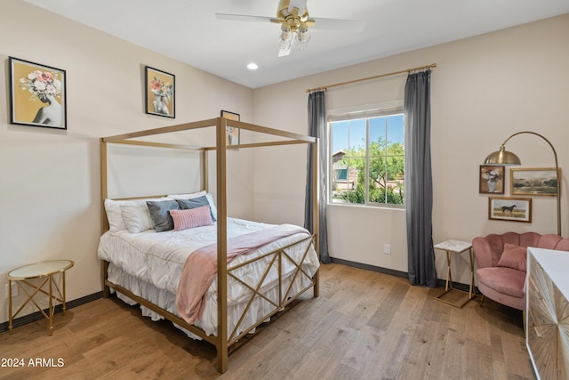 bedroom featuring light hardwood / wood-style flooring and ceiling fan