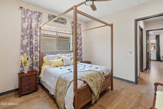 bedroom featuring light hardwood / wood-style floors and ceiling fan