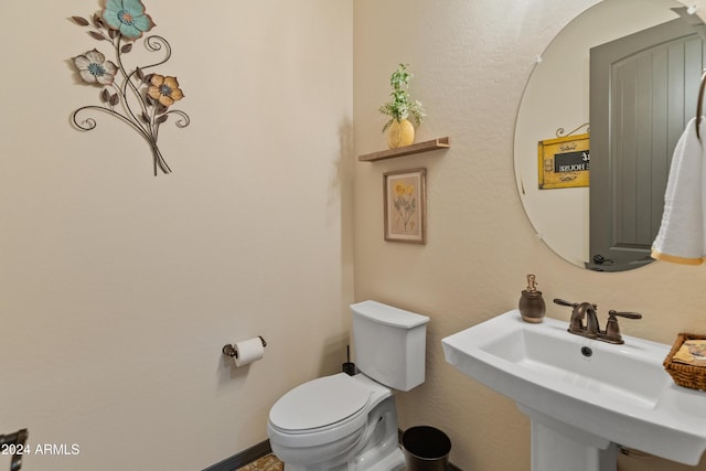 bathroom with toilet and sink