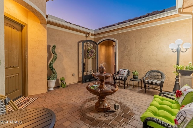 view of patio terrace at dusk