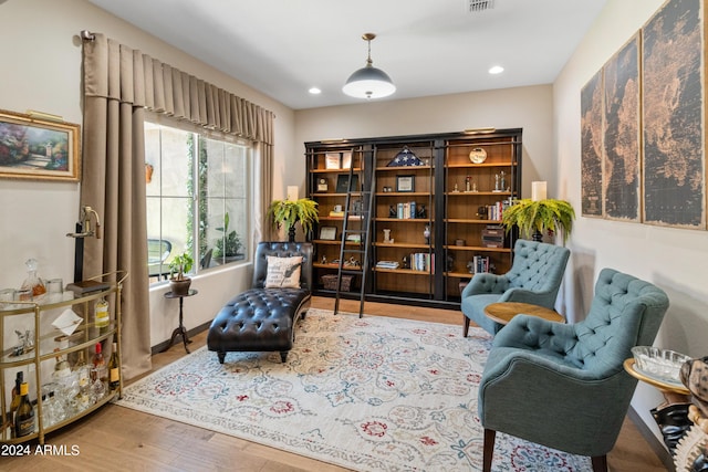 sitting room featuring hardwood / wood-style floors