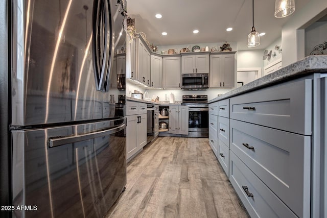 kitchen with recessed lighting, gray cabinetry, stainless steel appliances, light wood-style floors, and pendant lighting