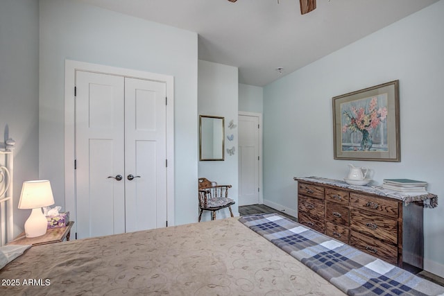 bedroom featuring a closet and baseboards