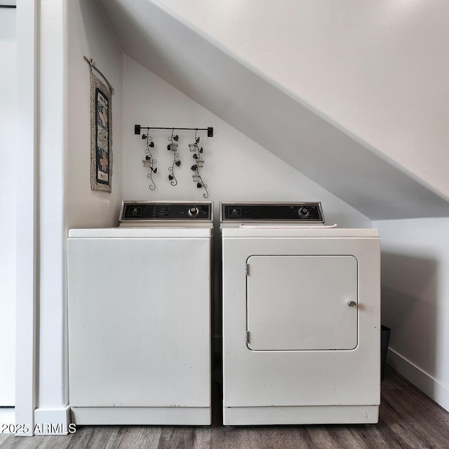 clothes washing area with laundry area, wood finished floors, independent washer and dryer, and baseboards