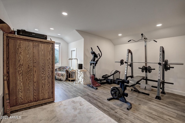 workout area with recessed lighting, wood finished floors, and vaulted ceiling