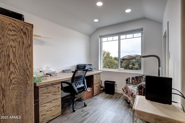 home office with vaulted ceiling, recessed lighting, baseboards, and light wood finished floors