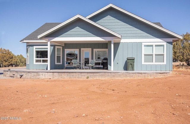 back of house with board and batten siding