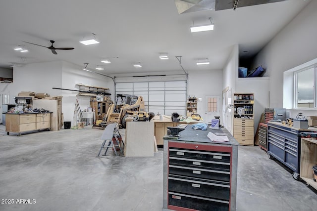 garage featuring a workshop area and ceiling fan