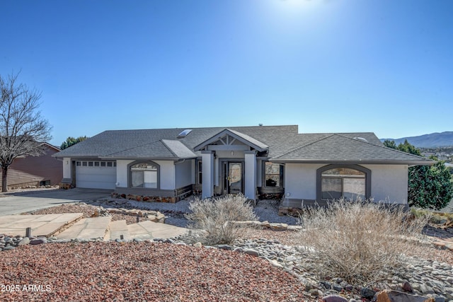 625 Shadow Mountain Dr, Prescott, AZ 86301 - view of front of house featuring a mountain view, a garage, stucco siding, driveway, and roof with shingles