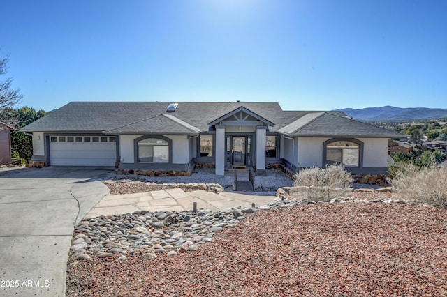 625 Shadow Mountain Dr, Prescott, AZ 86301 - view of front facade with roof with shingles, a garage, stucco siding, and concrete driveway