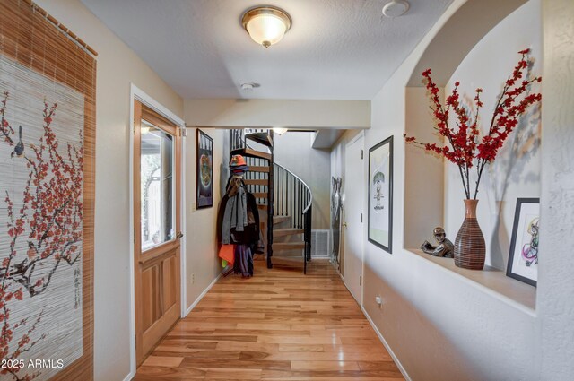 625 Shadow Mountain Dr, Prescott, AZ 86301 - hall featuring stairway, light wood-style flooring, baseboards, and a textured ceiling