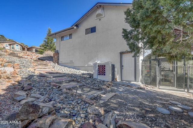 625 Shadow Mountain Dr, Prescott, AZ 86301 - back of property featuring fence, a gate, and stucco siding