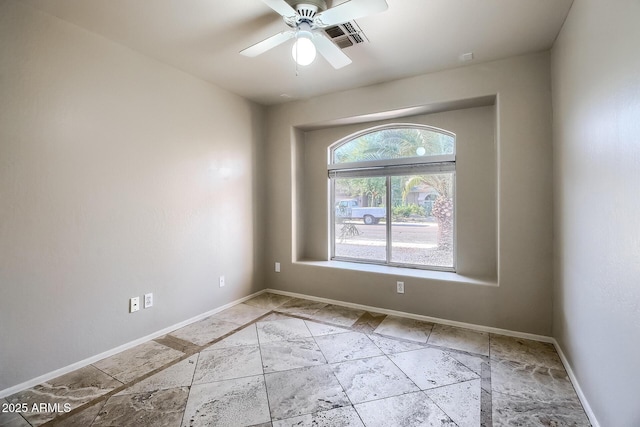 unfurnished room with ceiling fan