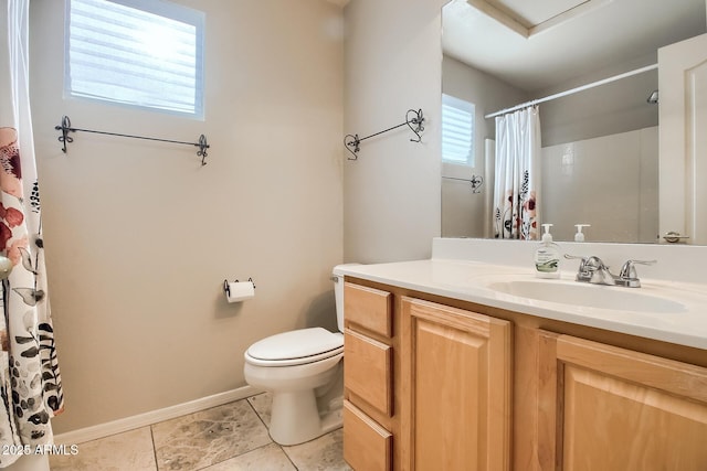 bathroom with vanity, tile patterned floors, and toilet