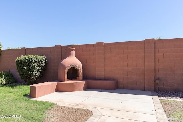 view of patio / terrace with a brick fireplace