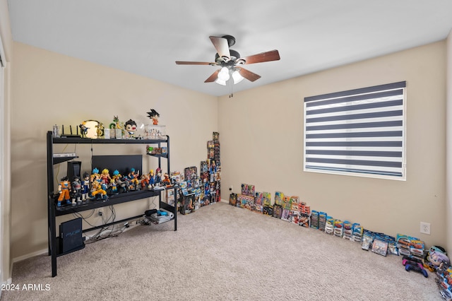 rec room featuring carpet and ceiling fan