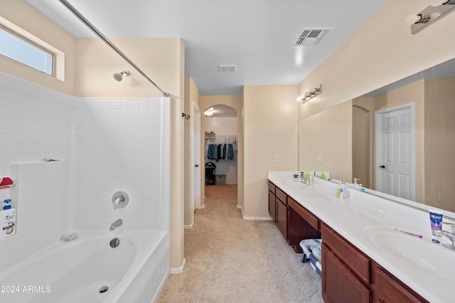 bathroom featuring vanity and washtub / shower combination