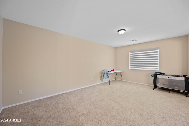 game room featuring light colored carpet