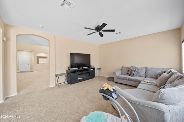 living room with light carpet and ceiling fan