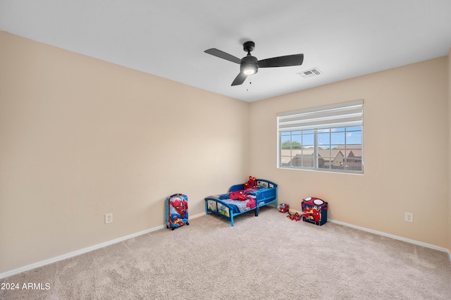 game room featuring carpet and ceiling fan